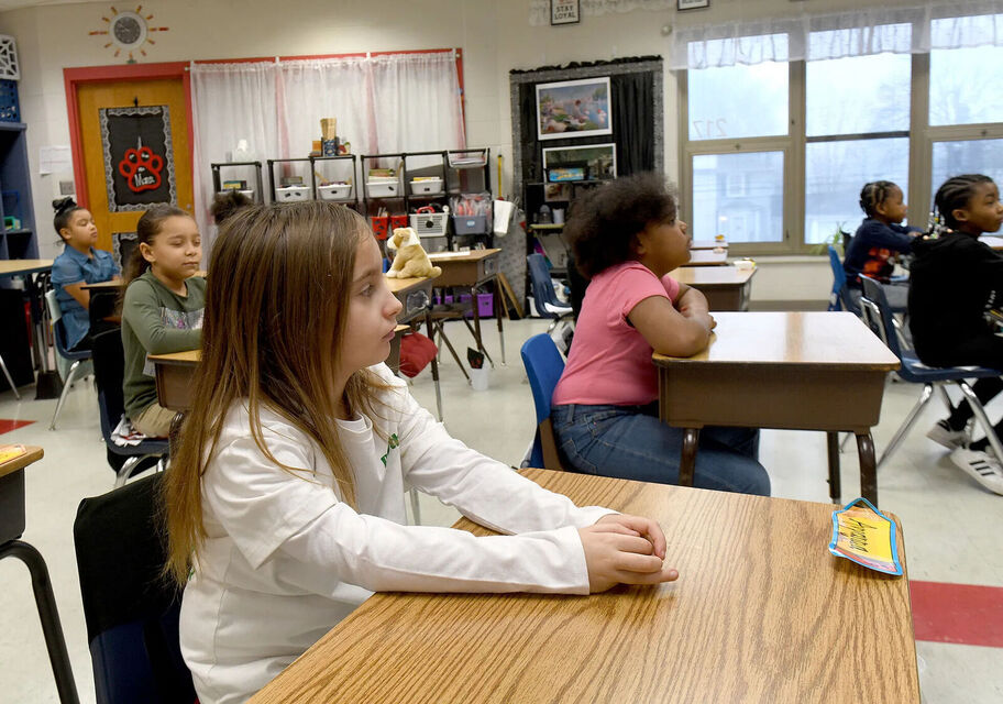 Students sitting quietly at their desks.